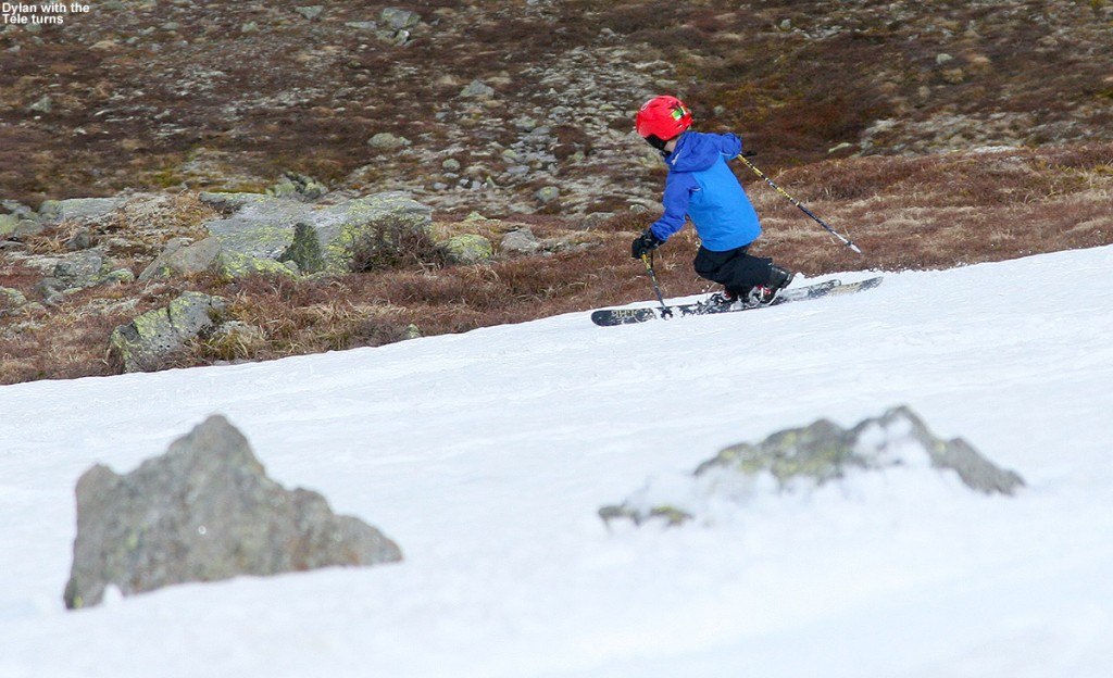 An image of Dylan Telemark skiing in May on the East Snowfields of Mt. Washington in New Hampshire