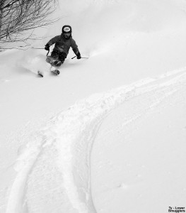 An image of Ty skiing powder snow on the Lower Smugglers trail at Stowe Mountain Resort in Vermont