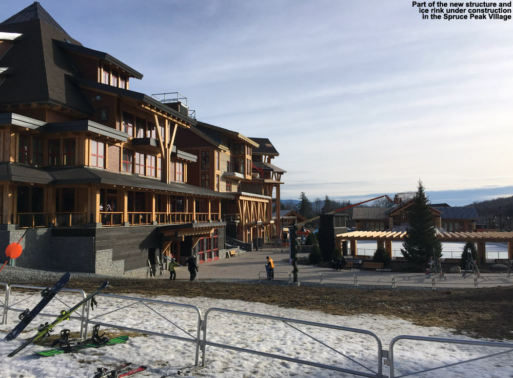 an image showing one of Stowe's new buildings under construction and the the ice rink added to the Spruce Peak Base Area