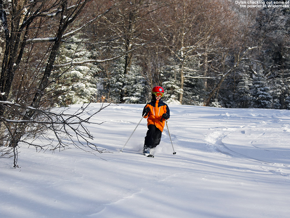 An image of Dylan skiing powder snow in the Wilderness area at Bolton Valley Resort in Vermont