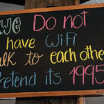 An image of a sign indicating Wifi availability at the Octagon restaurant atop Mt. Mansfield at Stowe Mountain Ski Resort in Vermont