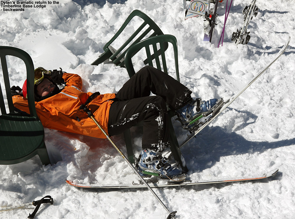 An image of Dylan having skied backwards into a bunch of chairs outside the Timberline Base Lodge at Bolton Valley Resort in Vermont