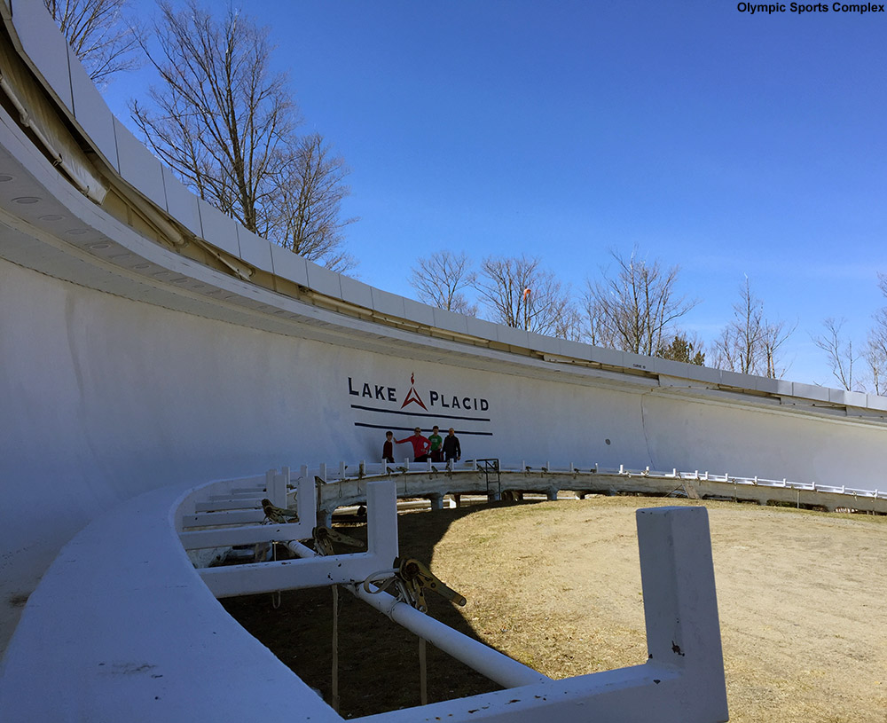 An image of people in the Lake Placid bobsled track at the Shady II turn