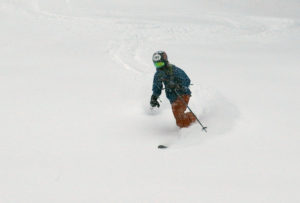 An image of Ty skiing powder during a December storm at Bolton Valley Resort in Vermont