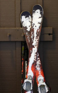 An image of RT-86 Telemark skis with snow on them at the base lodge of Bolton Valley Ski Resort in Vermont