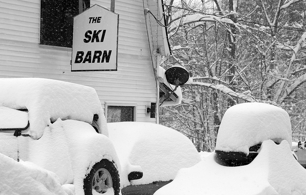 An image of the Ski Barn with new snow on the Bolton Valley Access Road near Bolton Valley Ski Resort in Vermont