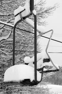 An image of one of the chairs on the Wilderness Chairlift filled with snow from Winter Storm Bruce at Bolton Valley Ski Resort in Vermont