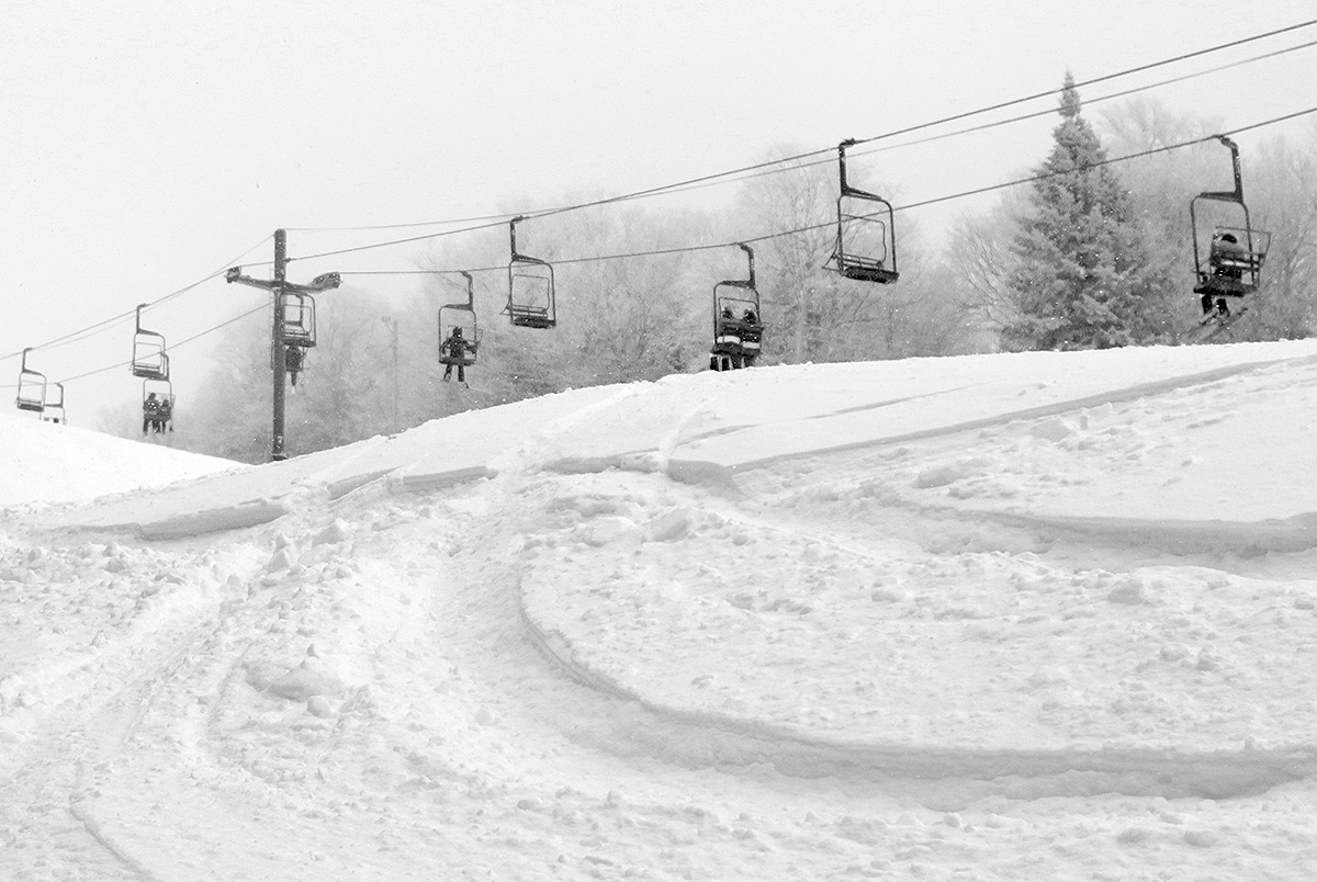 An image of snow from Winter Storm Carrie and the tracks of skiers on the Beech Seal trail at Bolton Valley Ski Resort in Vermont
