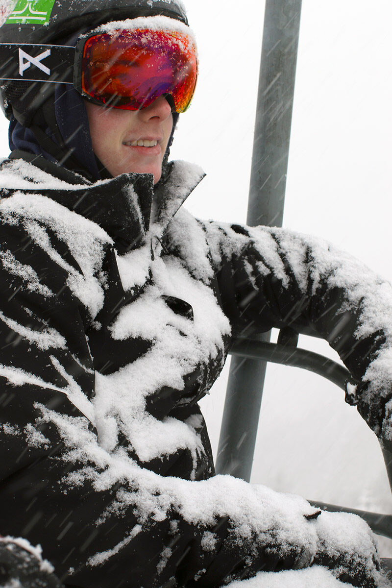 An image of Colin getting covered in snow while riding the Vista Quad Chair at Bolton Valley Resort in Vermont as Winter Storm Izzy produced snowfall rates of 1 to 2 inches per hour