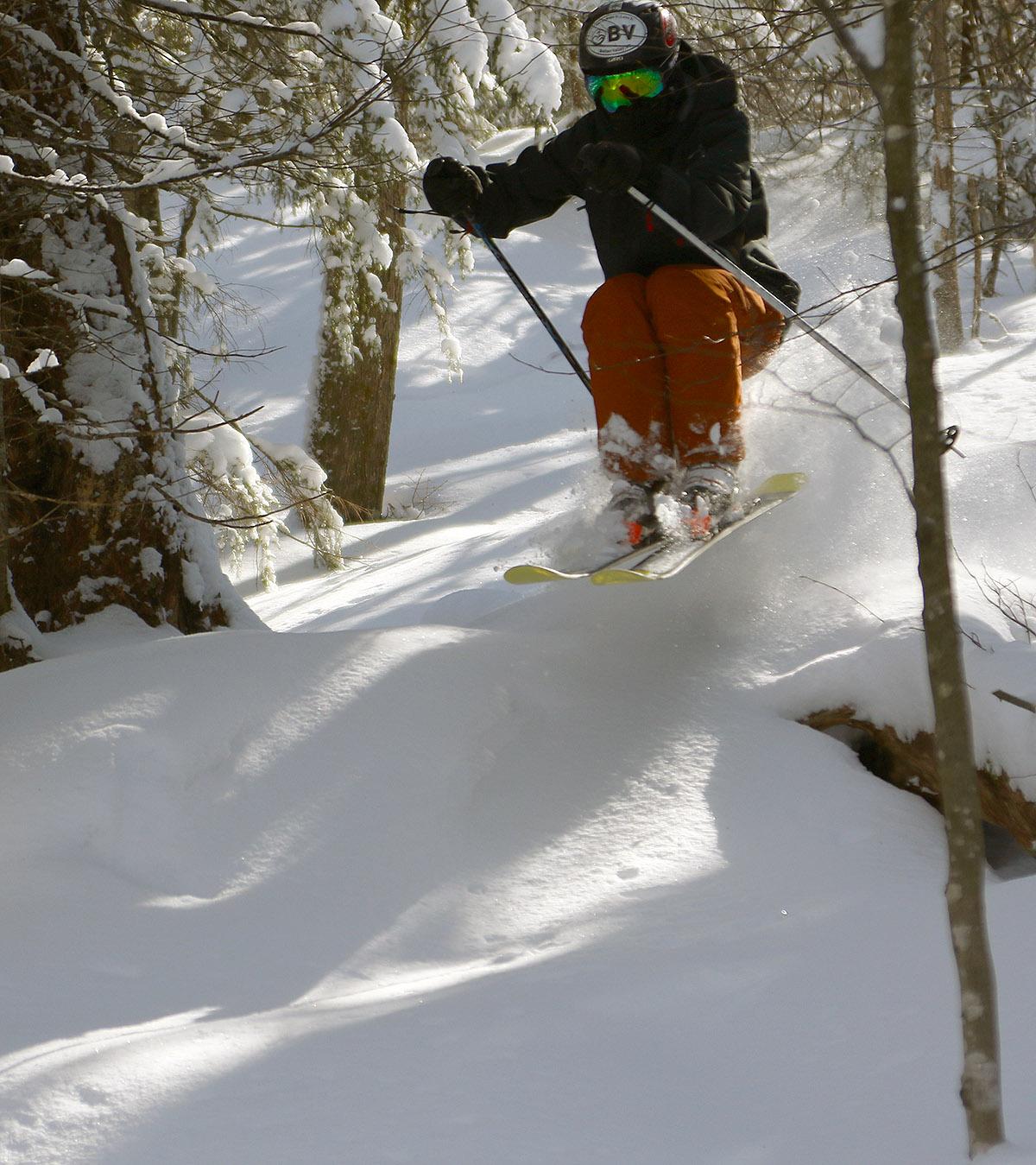 An image of Ty jumping while skiing the Wood's Hole area of Bolton Valley Ski Resort in Vermont