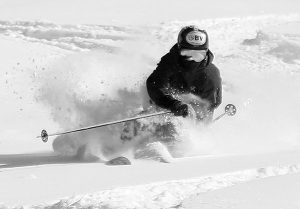 An image of Ty skiing powder from Winter Storm Oaklee in the Timberline area at Bolton Valley Ski Resort in Vermont