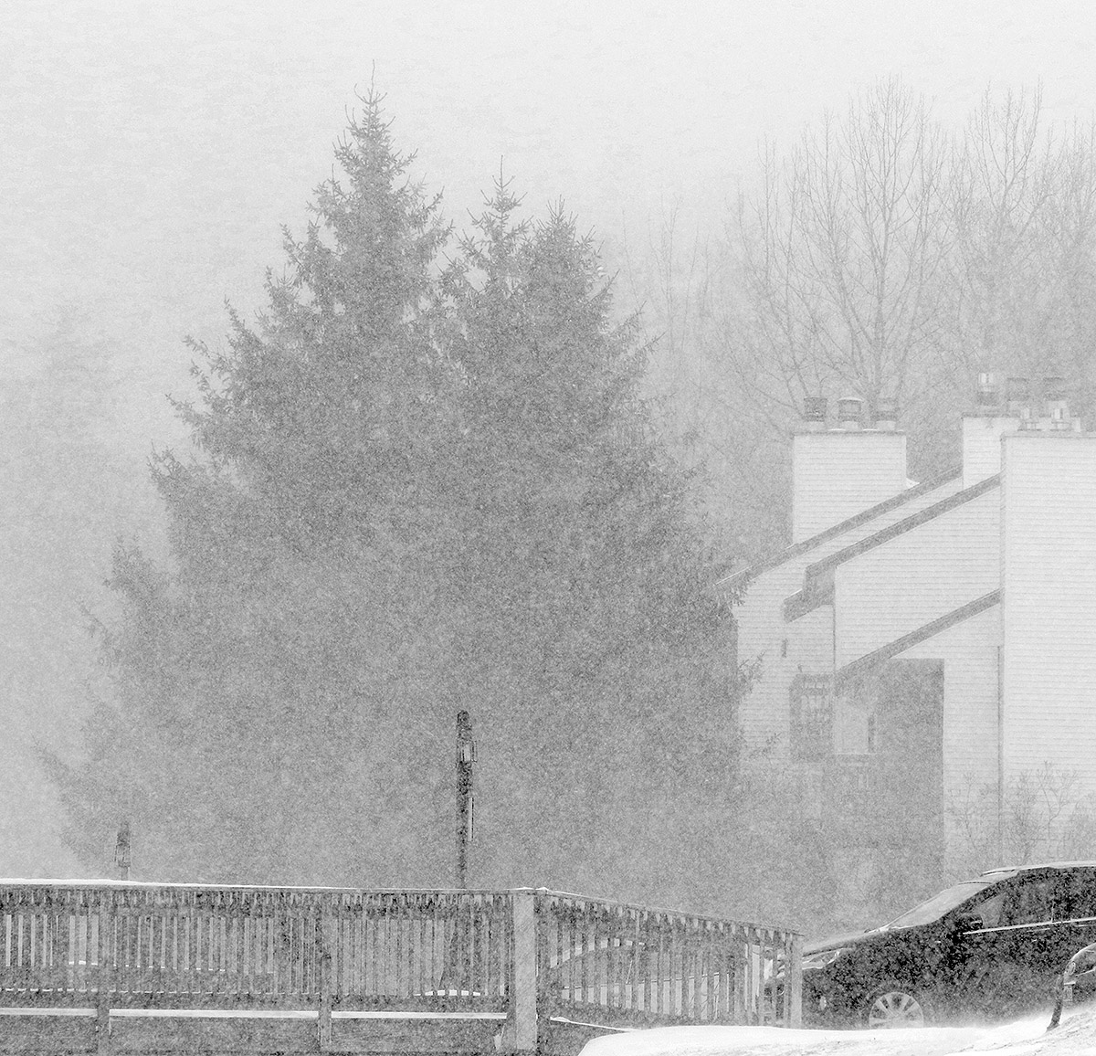 An image of heavy snowfall taking place during a March snowstorm in the village area of Bolton Valley Ski Resort in Vermont