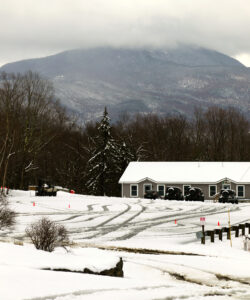 An image of fresh snow from an April snowstorm in the Timberline area parking lots at Bolton Valley Ski Resort in Vermont