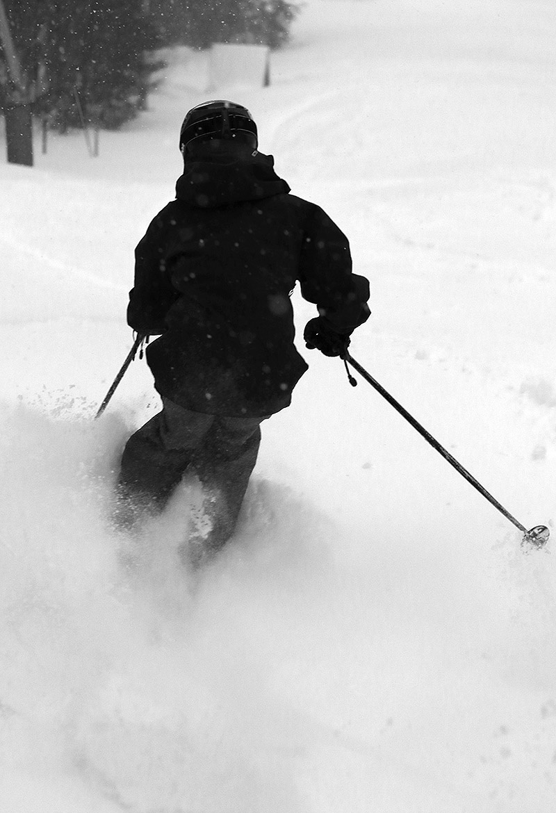 An image Ty schussing through some of the fresh powder during Winter Storm Diaz near Mid Mountain on Sherman's Pass at Bolton Valley Ski Resort in Vermont