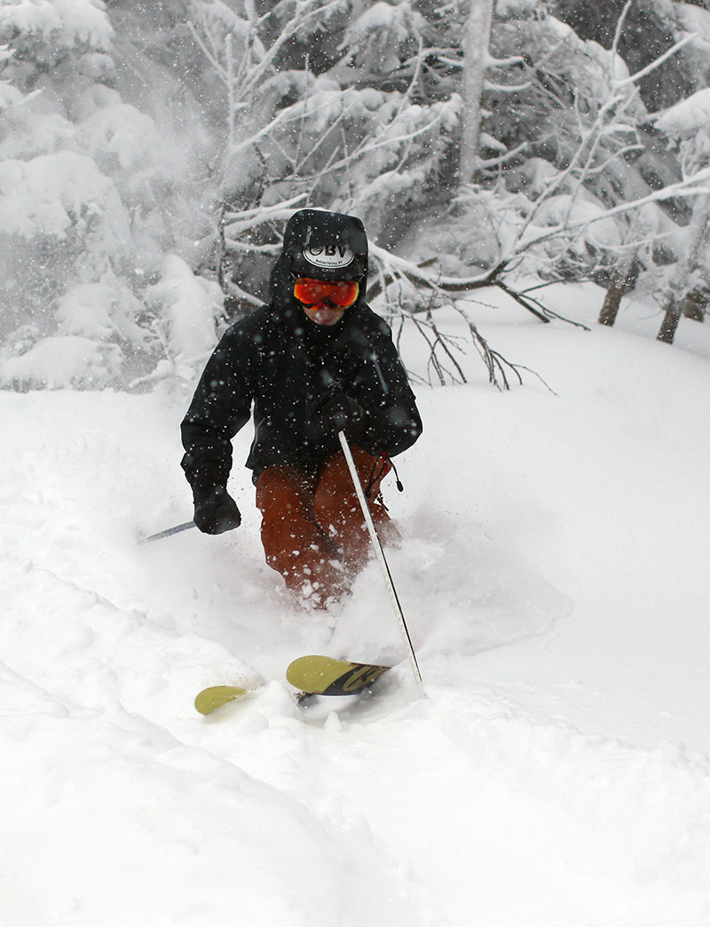 An image of Ty skiing powder on Spillway Lane during Winter Storm Diaz at Bolton Valley Ski Resort in Vermont