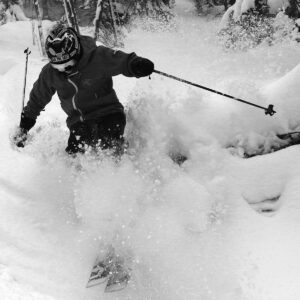An image of Jay blasting through some of the powder left by Winter Storm Kassandra at Bolton Valley Ski Resort in Vermont