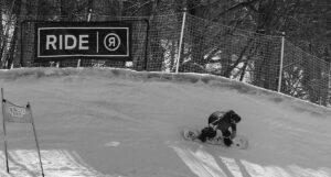 An image of a snowboarder on the Blauvelt's Banks race course in the Timberline area at Bolton Valley Ski Resort in Vermont