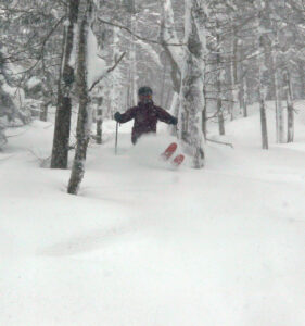 An image of Dylan skiing the trees in deep snow from Winter Storm Sage at Bolton Valley Resort in Vermont