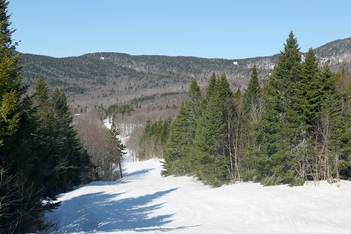 An image showing part of the Bolton Valley Ski Resort in Vermont viewed from the top of the Timberline Quad Chairlift