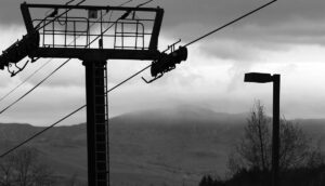 An image looking out toward the Worcester Range with clouds at summit level viewed from the base of the Gondola at Stowe Mountain Resort in Vermont