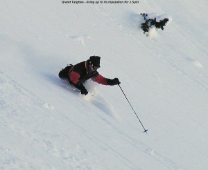 A picture of Jay skiing powder below Peaked Mountain Grand Targhee Resort Wyoming