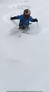 Image of Ty skiing powder on Five Corners
