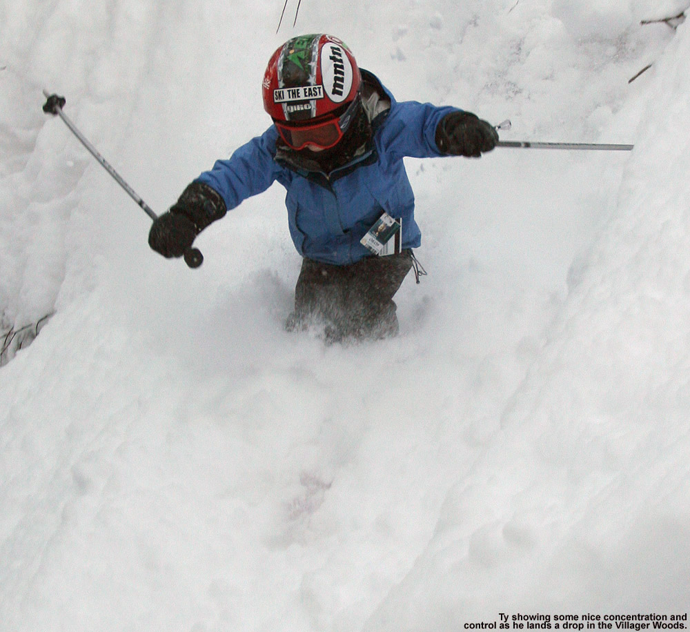 An image of Ty dropping into powder off a cliff in the Villager Trees at Bolton Valley Ski Resort in Vermont