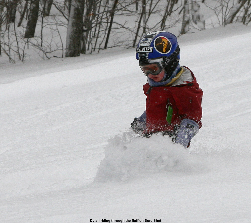 An image of three-year old Dylan skiing the powder on the Sure Shot trail at Bolton Valley Ski Resort in Vermont