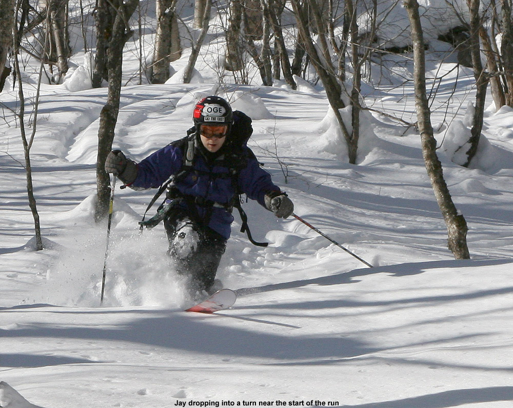An image of Jay Telemark skiing in powder snow on Bald Hill near Camel's Hump in Vermont