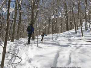 An image of Ty and James ascending Bald Hill on their skis near Camel's Hump in Vermont