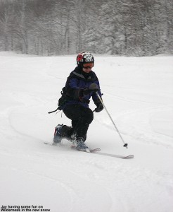 Image of Jay Telemark skiing in new snow