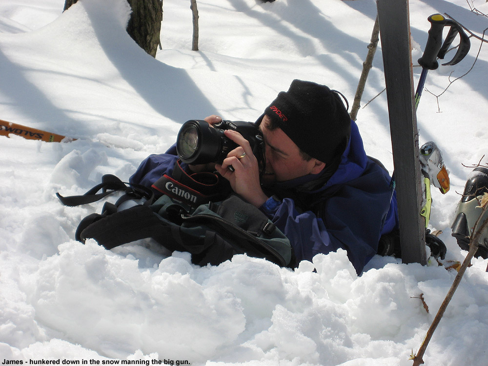 An image of James shooting photos with a Canon EOS 30D on a backcountry ski trip to Pease Mountain in Vermont
