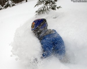 Image of Dylan getting a face shot in deep powder