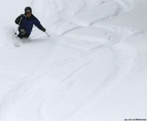 An image of Jay skiing powder