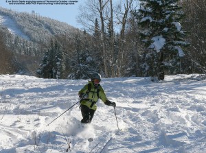 An image of Erica skiing powder on the Birch Glades Trail at Pico Vermont - October 30, 2011
