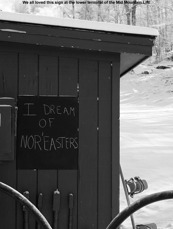 A sign on the lower terminal of the Mid Mountain Lift at Bolton Valley that says "I Dream of Nor'easters"