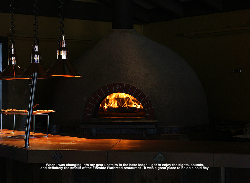 An image of flames in the wood-fired oven up at the Fireside Flatbread Restarant at Bolton Valley ski resort in Vermont