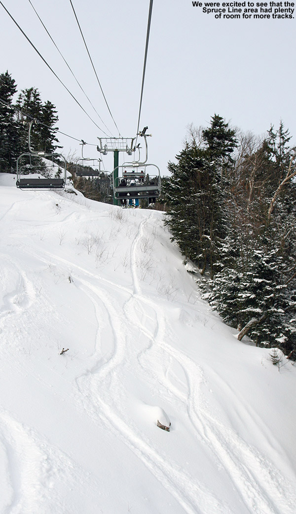 An image of ski tracks in powder snow on the Spruce Line Trail at Stowe Mountain Resort in Vermont