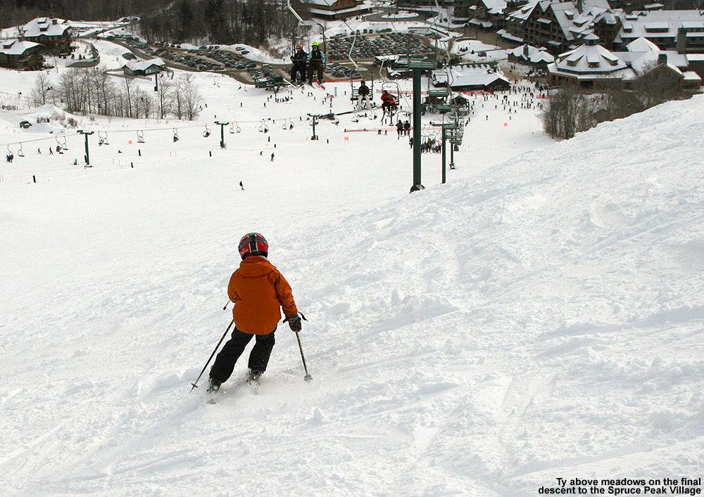 An image of Ty skiing in the open terrain above the Meadows trail at Stowe Mountain Resort in Vermont
