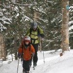 An image of Erica and Ty skinning up the Catamount Trail along the edge of a glade