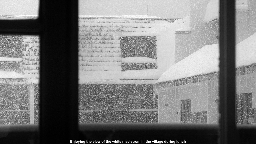 A view out the window of the base lodge at very heavy snowfall hitting Bolton Valley Ski Resort in Vermont