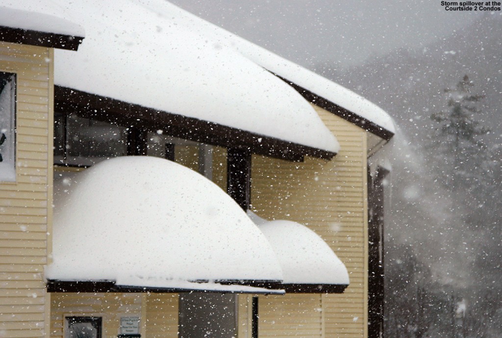An image of deep snow accumulating on the Courtside 2 Condominiums during a big snowstorm at Bolton Valley Ski Resort in Vermont