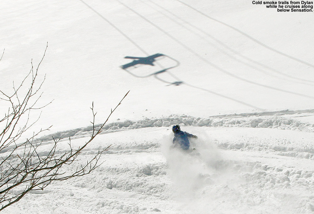 An image of Dylan cruising through the powder below the Sensation Quad Chairlift at Stowe Mountain Ski Resort in Vermont