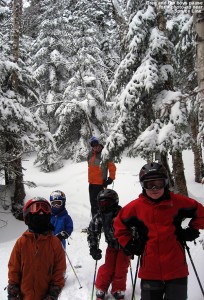 An image of Greg and the boys stopping in the powdery woods for a photo during one of our trips on the Sensation Quad at Stowe Mountain Ski Resort in Vermont