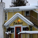 A winter image of the snow-covered exterior of Piecasso restaurant in Stowe, Vermont