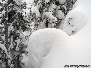 An image of deep pillows of snow along the Kitchen Wall Traverse at Stowe Mountain Ski Resort in Vermont