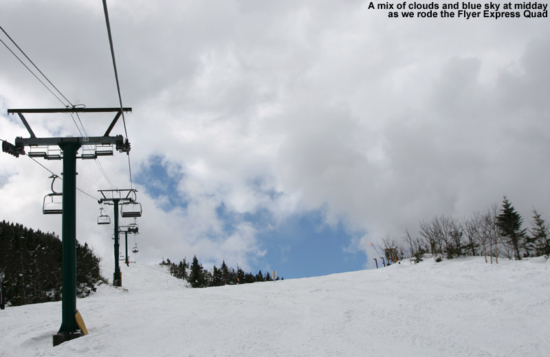 An image of blue skies and fresh snow viewed while riding the Flyer Express Quad at Jay Peak Ski Resort in Vermont