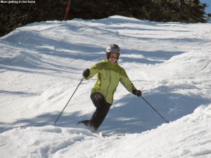 An image of Erica Telemark skiing in the spring snow at Stowe Mountain Resort in Vermont on March 31, 2012
