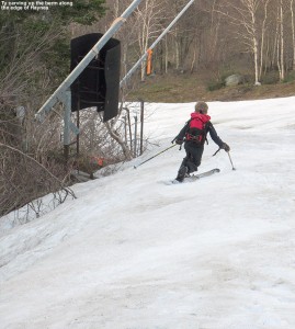 An image of Ty making a Telemark turn on the Haynes Trail at Jay Peak Resort in Vermont in mid May