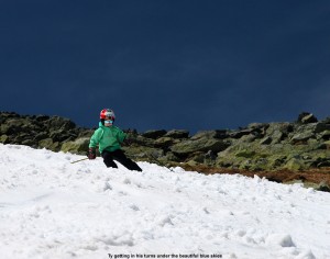 An image of Ty skiing under beautiful blue skies on the Mount Washington snowfields on Memorial Day Weekend 2012